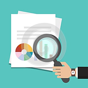 Businessman hand with magnifying glass, search concept on white paper with graph, reports icon. Data analysis concept for business photo