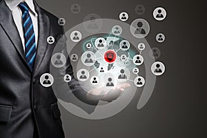 Businessman hand with people icons network connection. Business