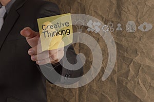 businessman hand point creative thinking on sticky note with icons crumpled recycle paper