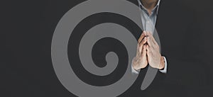 Businessman hand praying and worship to GOD Using hands to pray in religious beliefs and worship christian in the church or in gen