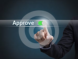 Businessman hand pressing button approve. sign on virtual screen