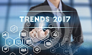 Businessman hand pressing button trends 2017.