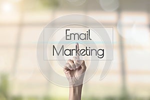 Businessman hand pressing wording Email marketing.