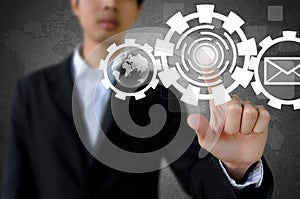 Businessman hand pushing button with touch screen interface