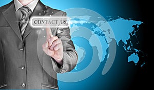 Businessman hand pushing contact us button