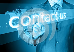 Businessman hand pushing contact us button