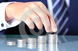 Businessman hand put coins