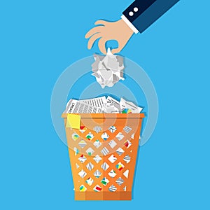 Businessman hand put paper in recycle bin