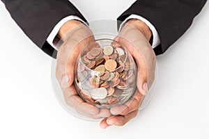 Businessman hand putting the coins on the glass, concept of saving  money for finance accounting