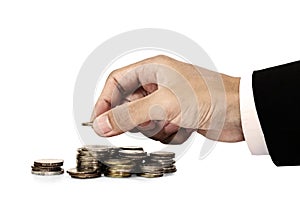 Businessman hand putting money coins, saving money concept, isolated on white background