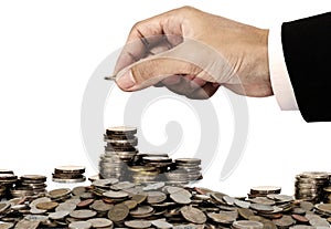 Businessman hand putting money coins, saving money concept, isolated on white background