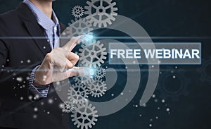 Businessman hand select wording free webinar.