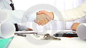 Businessman hand shake for selling house