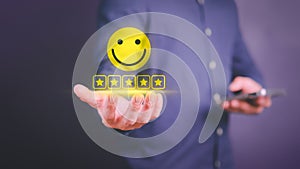 Businessman hand show happy smile face with 5 star. Positive review and feedback.