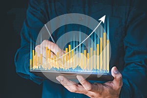 Businessman hand show Stock chart showing rising stock sign with graph indicator. Interest rate financial and mortgage rates