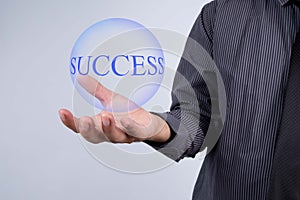 Businessman hand showing blue ball with success word. Marketing