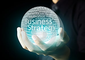 Businessman hand showing business strategy word photo