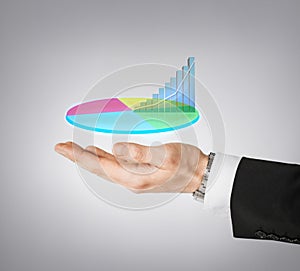 Businessman hand showing chart on virtual screen