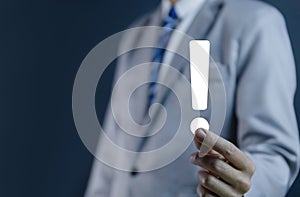 businessman hand showing exclamation point business development ideas Warning of errors, dangers, alerts, maintenance, And finding