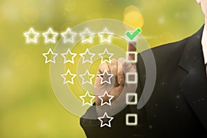 Businessman hand showing on five star excellent rating, leave feedback. Business services rating, customer experience concept