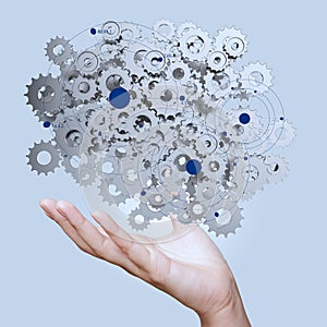 Businessman hand showing gears cogs to success