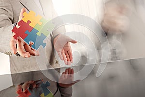 Businessman hand showing partnership sign