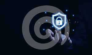 Businessman hand showing shield icon with lock sign. Computer password protection concept, internet network security, cyber