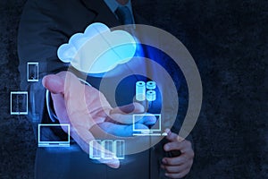 Businessman hand shows a Cloud Computing diagram