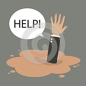 Businessman hand sinking in a puddle of quicksand