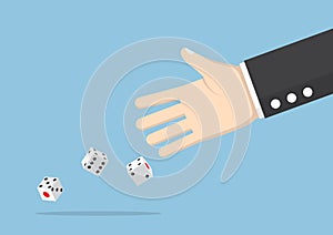 Businessman hand throwing dice