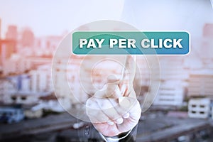 Businessman hand touch screen graph on PAY PER CLICK.
