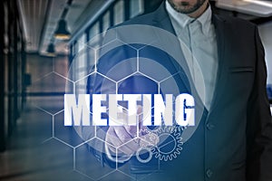 Businessman hand touching MEETING point, network connection