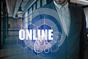 Businessman hand touching ONLINE point, network connection