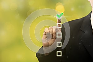 Businessman hand touching and pointing right choice, best option on blurred green background. Strategy of choice. Business