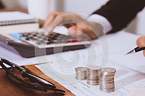 businessman hand using calculator Calculating bonus