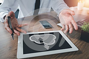 Businessman hand using digital tablet with cloud computing icon