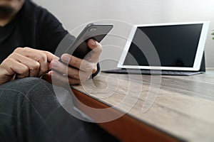 businessman hand using smart phone,mobile payments online shopping,omni channel,digital tablet docking keyboard computer in