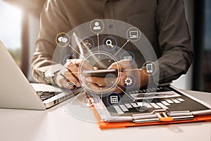 Businessman hand using smart phone, tablet payments online shopping, omni channel, digital tablet docking keyboard computer at