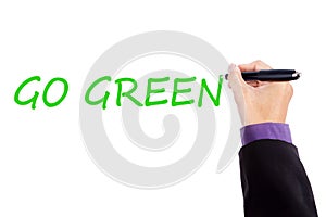 Businessman hand writes Go Green text