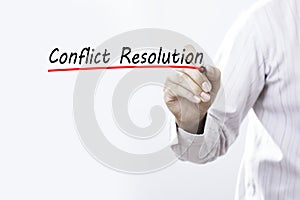 Businessman hand writing Conflict Resolution. Business concept.