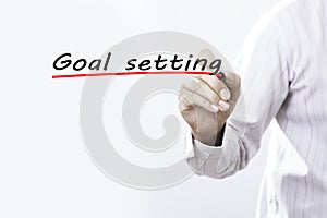 Businessman hand writing goal setting with marker, Business concep