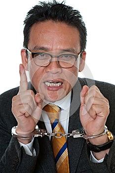 Businessman with handcuffs photo