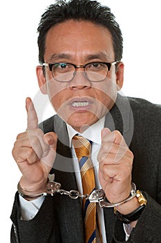 Businessman with handcuffs photo