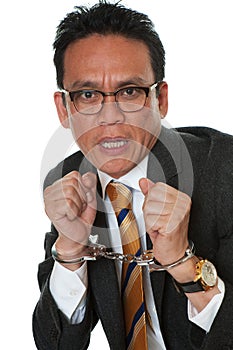 Businessman with handcuffs photo