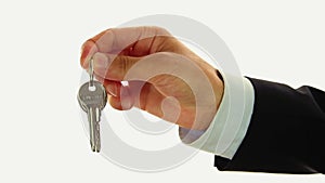 Businessman handing keys of house