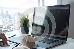 Businessman hands busy using laptop at office desk