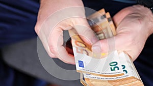 Businessman hands counting big euro bills money