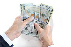 Businessman hands counting money,US dollar (USD) bills