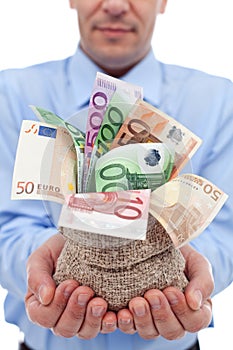 Businessman hands with euro banknotes in a money bag photo