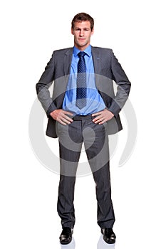 Businessman hands on hips isolated